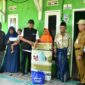 Bupati Fauzi dan Ketua BAZNAS Sumenep A. Rahman Saat menyalurkan bantuan rehabilitasi Rumah Tidak Layak Huni (RTLH) kepada warga di Kecamatan Lenteng dan Kecamatan Ganding, Selasa (28/7/2026)